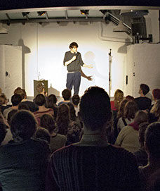 Simon Amstell on stage at the Invisible Dot, designed by Lyndon Goode Architects