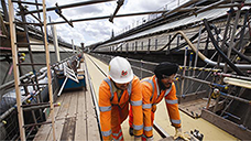 Image shows the main train shed roof at King’s Cross being refurbished, as part of the station’s £500m redevelopment programme.